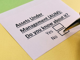 A person is answering question about assets under management.