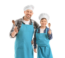 Portrait of male chef and his little son on white background