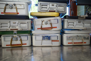 in a sterilization department instrument containers are stacked next to each other