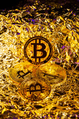 Gold Bitcoin Cryptocurrency in the centre surrounded by another coins with golden background. Halving. Trading. Reflection. Mining