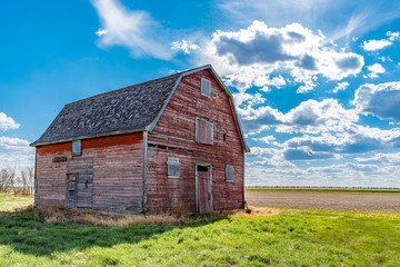 Fototapeta na wymiar Vintage red barn on the prairies near White Bear, Saskatchewan 