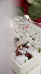 Wedding box with flowers and rings.
