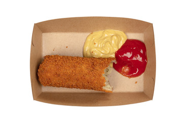 Partly eaten brown crusty dutch kroket with mustard and ketchup isolated
