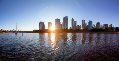 Fototapeta na wymiar False Creek, Downtown Vancouver, British Columbia, Canada. Beautiful Panoramic View of Modern City during a sunny spring sunset. Cityscape Panorama