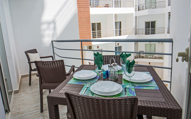 Terrace balcony with chairs in tropical luxury apartment resort