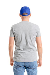 Handsome man in stylish cap on white background