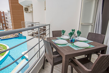 Terrace balcony with chairs in tropical luxury apartment resort