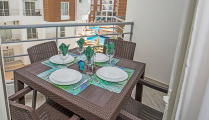 Terrace balcony with chairs in tropical luxury apartment resort
