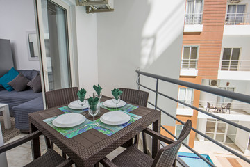 Terrace balcony with chairs in tropical luxury apartment resort