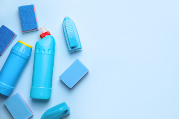 Set of cleaning supplies on color background