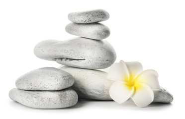 Obraz na płótnie Canvas Spa stones and flower on white background