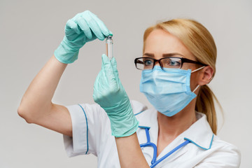 health medical worker woman holding tube with vaccine