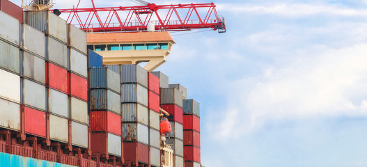 Container cargo ship load in the seaport. Logistics and transportation of Container Cargo ship with...