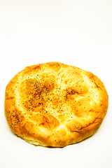Ramadan Pita (Ramazan Pidesi) Traditional Turkish bread for holy month Ramadan on white background. Ramadan concept.