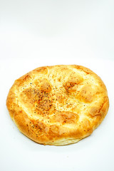 Ramadan Pita (Ramazan Pidesi) Traditional Turkish bread for holy month Ramadan on white background. Ramadan concept.