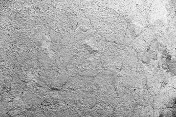Texture of a concrete wall with cracks and scratches which can be used as a background