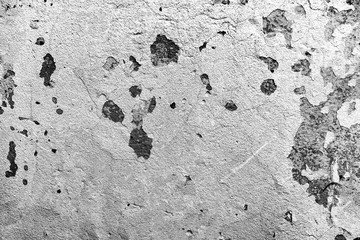 Texture of a concrete wall with cracks and scratches which can be used as a background