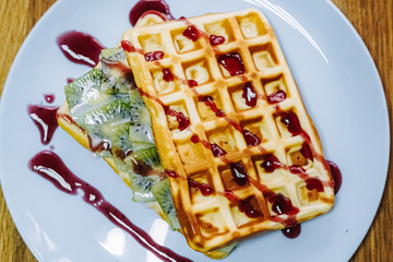 tasty Belgium waffle with organic sweets served for breakfast