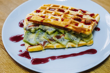 tasty Belgium waffle with organic sweets served for breakfast