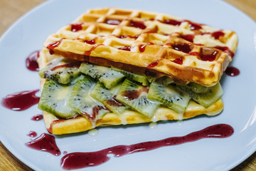 tasty Belgium waffle with organic sweets served for breakfast
