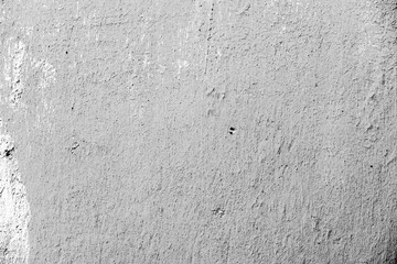 Texture of a concrete wall with cracks and scratches which can be used as a background