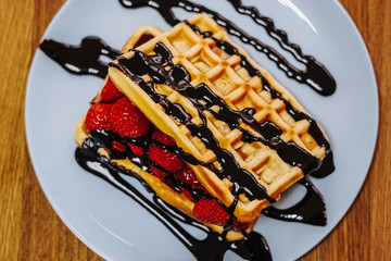 tasty Belgium waffle with organic sweets served for breakfast