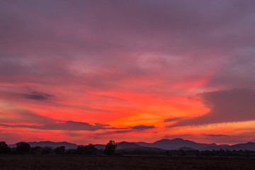 sunset over mountain countryside 