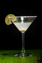 margarita cocktail in martini glass on a dark background