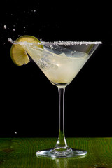 margarita cocktail in martini glass on a dark background
