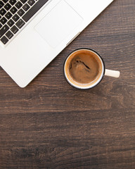 wooden desk table with computer and hot coffee