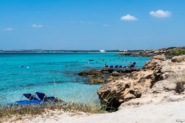 Fototapeta na wymiar Golden beaches and clear sea. Magic of Salento. Punta della Suina. Puglia, Italy