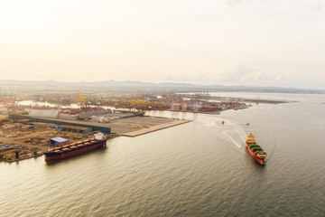 Fototapeta premium Container ship leaving the port, aerial view, Logistics and transportation of Container Cargo ship