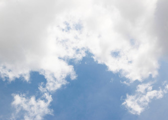 soft white clouds against blue sky background.