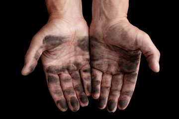 dirty male hands on a black background