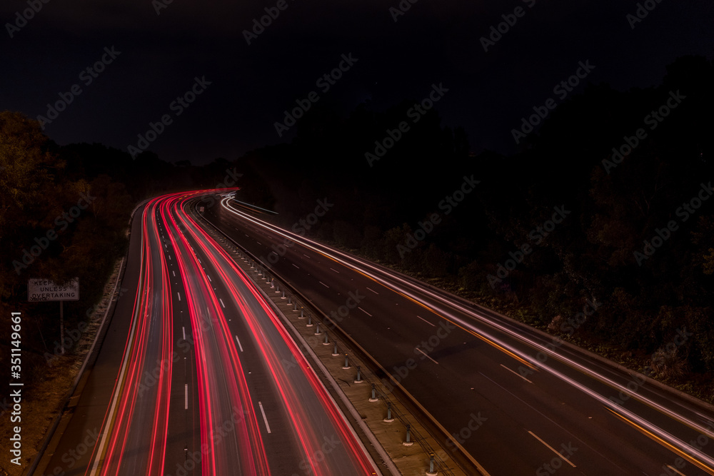 Wall mural car light trails at night