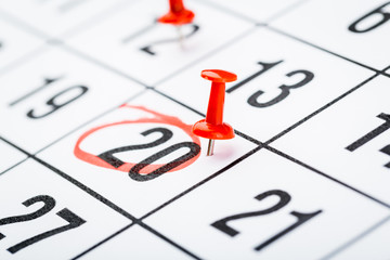 2020 calendar page marked with an important date in red pin. timeline, time, concept, idea,...