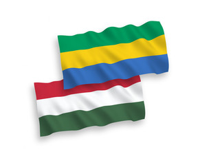 Flags of Gabon and Hungary on a white background