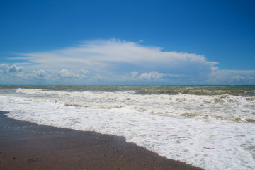 Fototapeta na wymiar Light wave on the sea beach