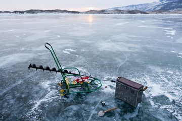 Winter fishing on the ice of Lake Baikal.