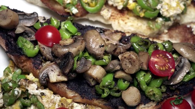 Panning on colorful brushetta, comfort food on white background.
