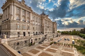 North facade of Royal Palace in Madrid in summer day at sunset with dramatic sky, Spain.