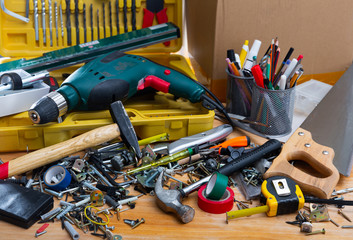 Table littered with various construction tools