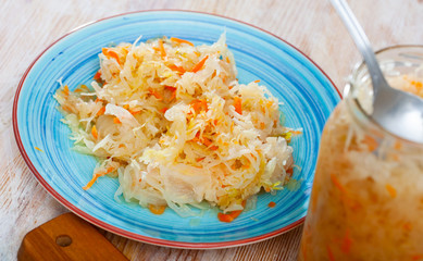 Homemade sauerkraut on white plate