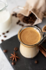 Dalgona coffee. Iced fluffy creamy whipped trend drink with coffee foam and milk. Trendy drink during Covid-19 city lock down and self quarantine, stay at home concept.