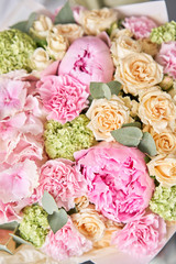 closeup Pink peonies and hydrangea. Beautiful bouquet of mixed flowers in woman hand. Floral shop concept . Handsome fresh bouquet. Flowers delivery.