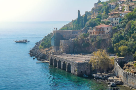 An old shipyard and the walls on the seashore in the center of Alanya