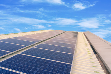 solar cells panel installed on the roof of a large building are full of dirt and dust.