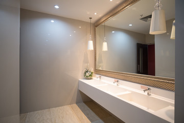 public empty restroom with washstands mirror,public toilet