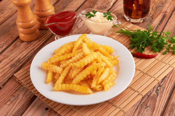 french fries on wooden table