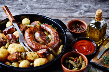 Easy pork sausage with young potato and gherkins